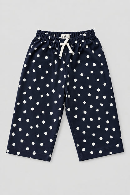 Pantalon large bleu marine à pois blancs, vue de face avec taille élastique et cordon