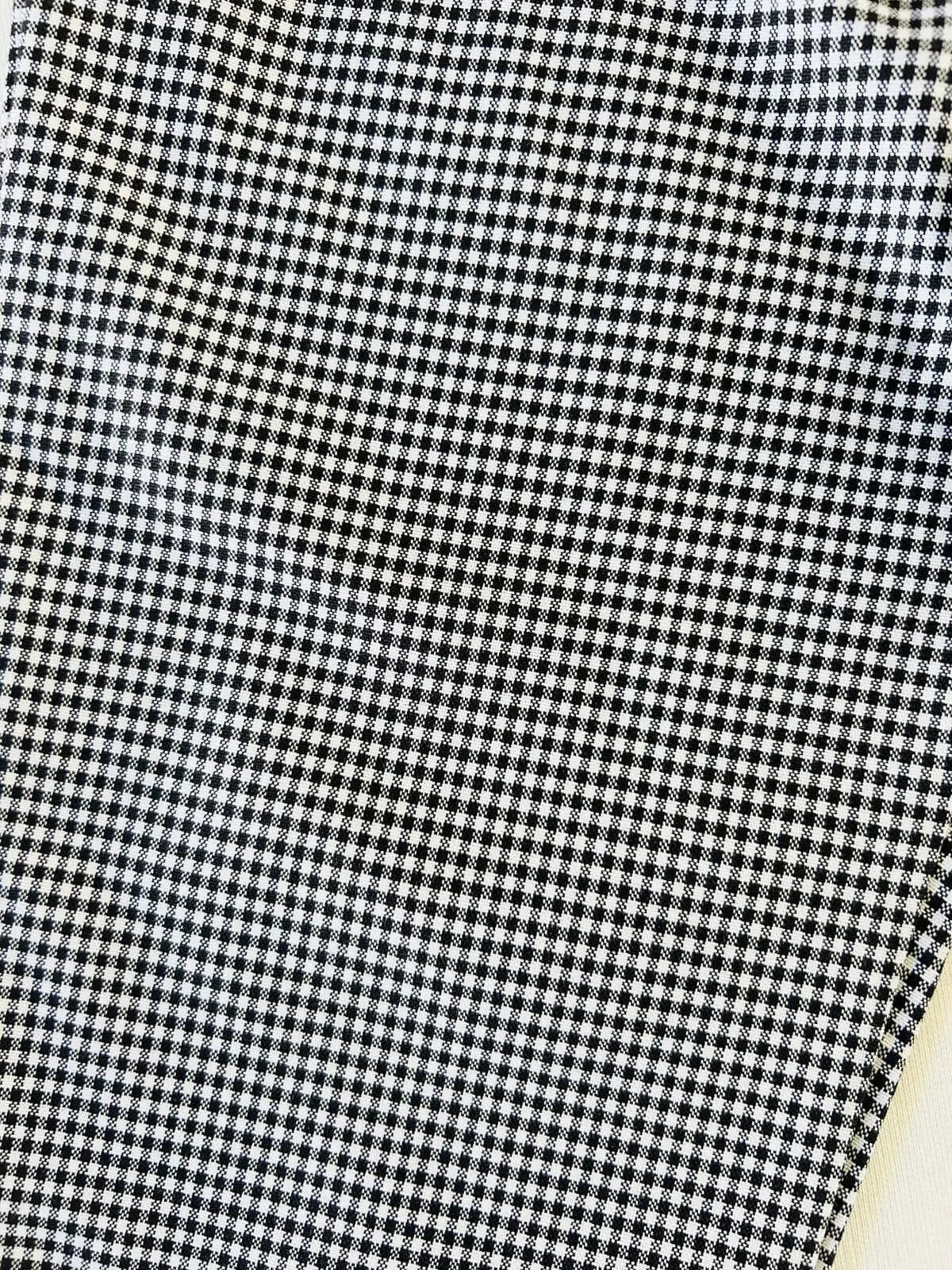 Zoom sur le tissu Oxford texturé et la ceinture cordon.