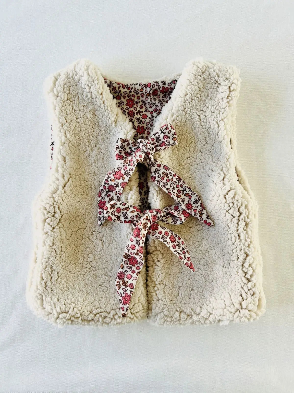 Veste sans manches chaude réversible côté sherpa écru.